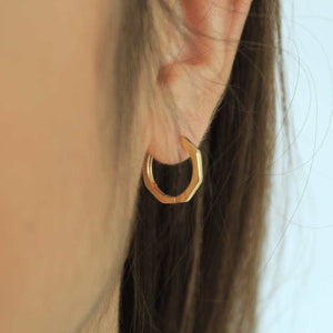 woman wearing 18k gold plated bamboo hoop earrings