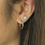 Load image into Gallery viewer, woman wearing sterling silver bamboo hoop earrings 
