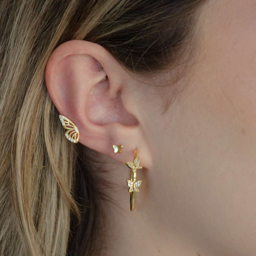 woman wearing sterling silver 18k gold plated sweetest butterfly earrings spread your wings earrings double butterfly hoop earrings