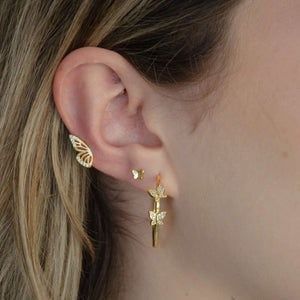 woman wearing sterling silver 18k gold plated sweetest butterfly earrings spread your wings earrings double butterfly hoop earrings