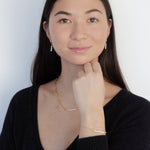 Load image into Gallery viewer, woman wearing sterling silver 18k gold mini hoop and pearl earrings
