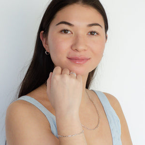 woman wearing sterling silver rhodium paperclip bracelet