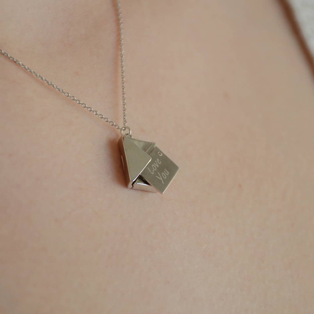 woman wearing sterling silver sent with love necklace