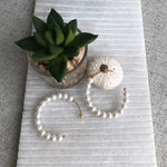 Load image into Gallery viewer, freshwater pearls on a hoop earrings
