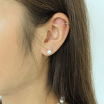 Load image into Gallery viewer, woman wearing pearl button earrings
