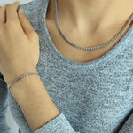 Load image into Gallery viewer, woman wearing sterling silver rhodium plated curb chain bracelet

