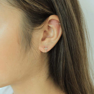 woman wearing sterling silver 18k gold plated cross earrings