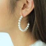 Load image into Gallery viewer, woman wearing freshwater pearls on a hoop earrings
