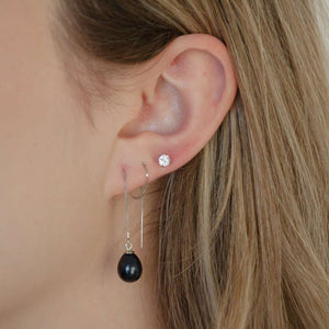 woman wearing sterling silver freshwater pearl drop thread earrings